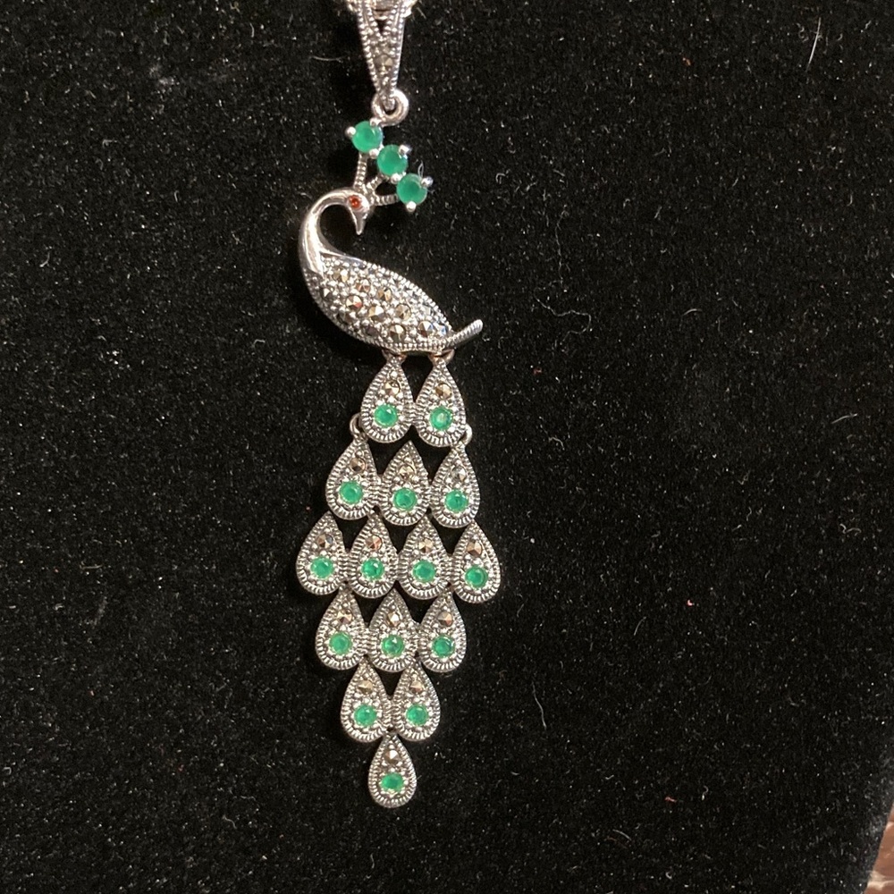 Sterling silver peacock with emerald and ruby , marcasite stones . Gorgeous